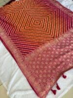 Rajvaari Bandhani Khaddi Georgette Saree – Rani Pink & Orange with Traditional Zari Weave